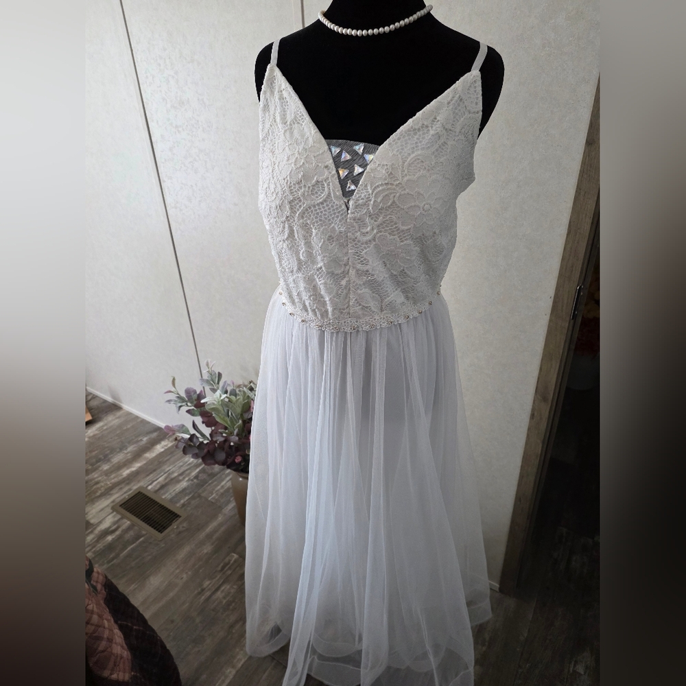 White Sleeveless Plunge Neck Wedding Gown